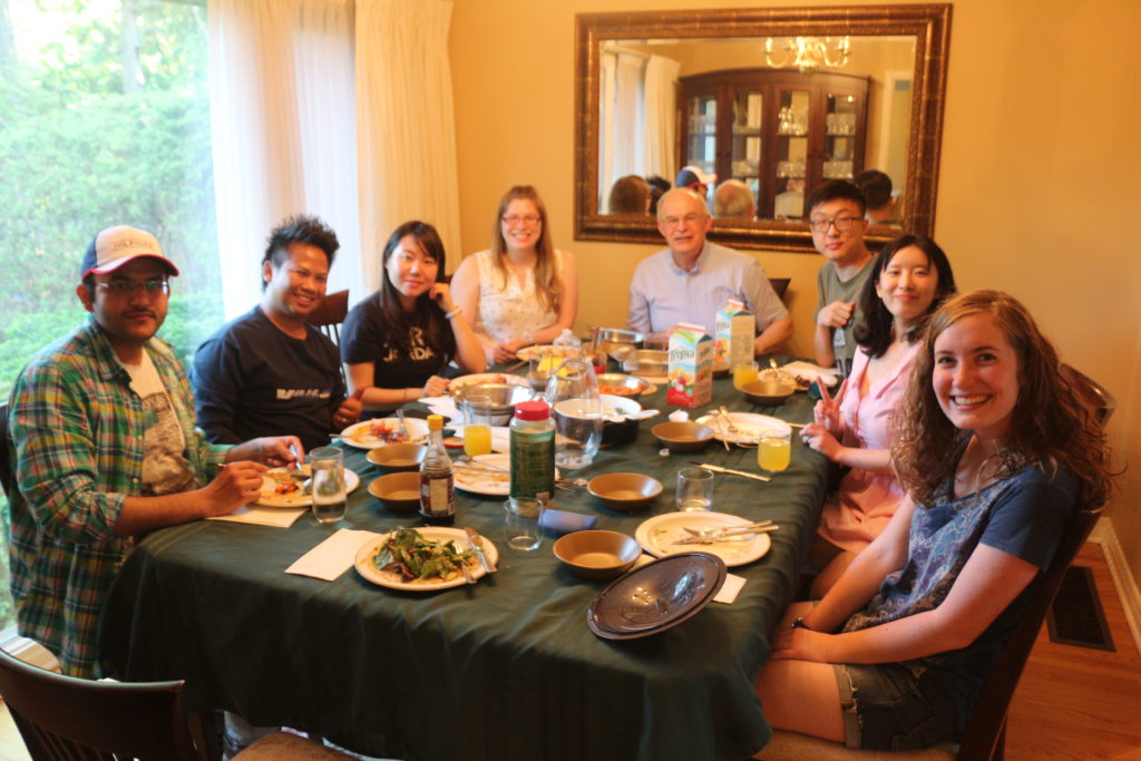 International students share a Thai meal with the Ja Eues. 